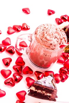 Heart shaped salted caramel cake on white background.