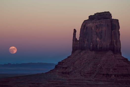 The full moon or supermoon rises over Monument Valley on Navajo Tribal Land on the Utah/Arizona border.