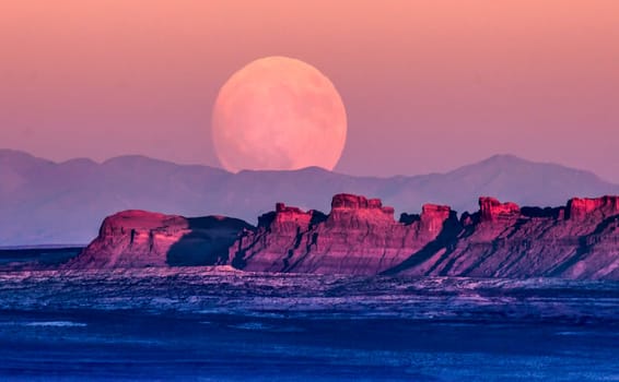 The full moon or supermoon rises over Monument Valley on Navajo Tribal Land on the Utah/Arizona border.