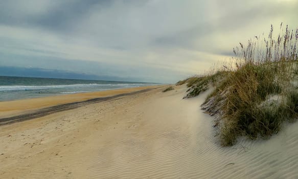 Sand Dunes and Ocean Waves make up the scene at Cape Hatteras National Seashore, North Carolina