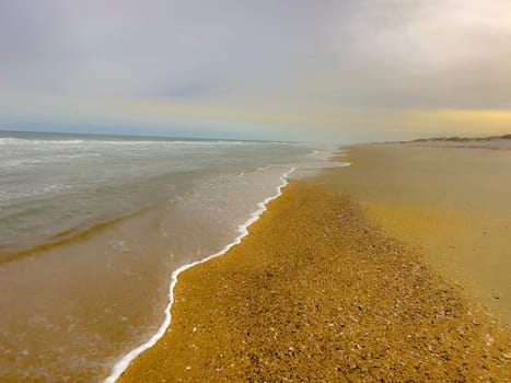 Sand Dunes and Ocean Waves make up the scene at Cape Hatteras National Seashore, North Carolina