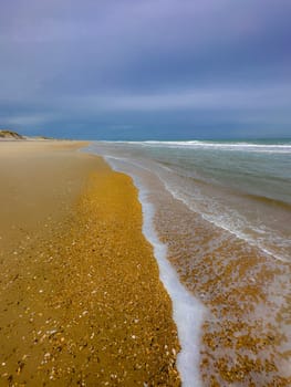 Sand Dunes and Ocean Waves make up the scene at Cape Hatteras National Seashore, North Carolina