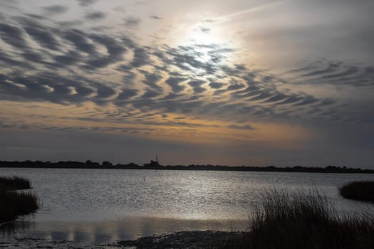 The sun sets on Oregon Inlet at Cape Hatteras National Seashore, North Carolina