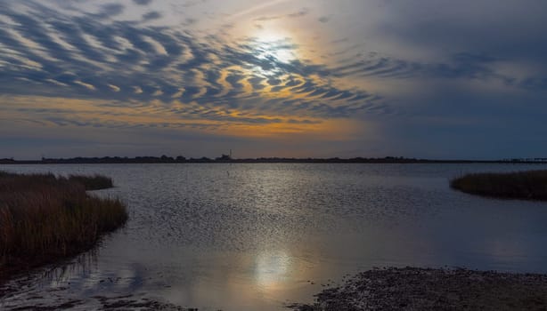 The sun sets on Oregon Inlet at Cape Hatteras National Seashore, North Carolina