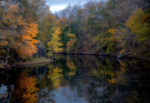 Fall are reflected in a river in rural New Hampshire