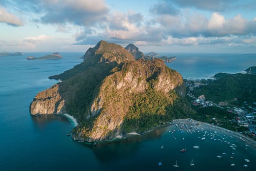 Aerial view of beach, sea and mountain on sunset. El Nido, Palawan