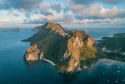 Aerial view of beach, sea and mountain on sunset. El Nido, Palawan