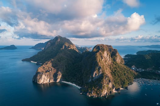 Aerial view of beach, sea and mountain on sunset. El Nido, Palawan