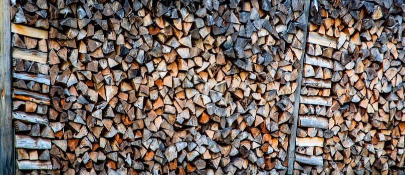 Firewood is stacked tightly on a farm in rural OPennsylvania