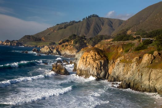 Waves crash along the rocky coastline south of Big Sur, California.