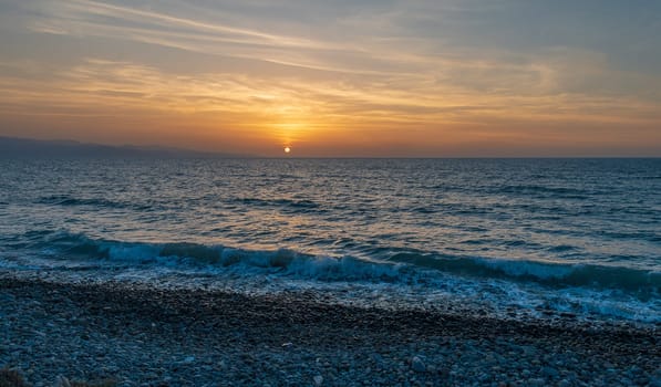 Bright sun at sunset. Mediterranean Sea