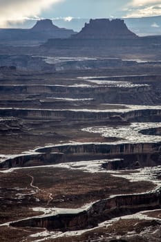 The Colorado River winds its way  through Canyonlands National Park as seen from the White Rim Overlook.