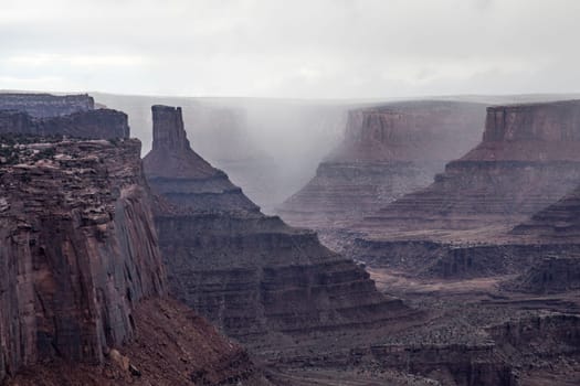 A rainstorm makes its way through Canyonlands National Park,Utah  as seen from the Shafer Trail Viewpoint.