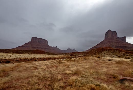 A passing rainstorm brings some clouds, fog and  dramatic looks to the landscape at Castle Valley, Utah