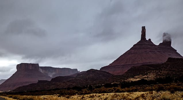 Fog has enveloped Castleton Tower on Bureau Of Land Management near Moab, Utah