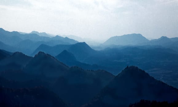 Haze and fog envelope the mountain ridgelines along Virginia's Blue Ridge Parkway.