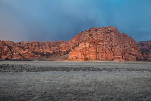 Red rock sandstone formations stand out at Cave Valley at Zion National Park, Utah