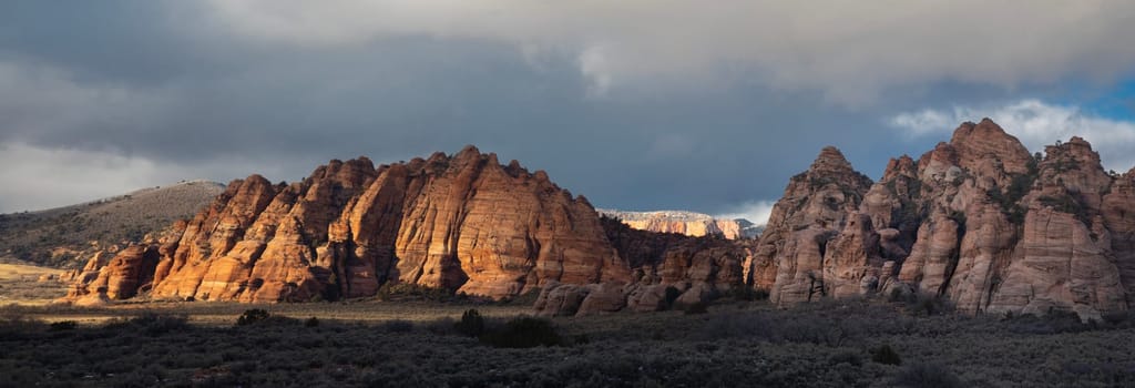 Red rock sandstone formations stand out at Cave Valley at Zion National Park, Utah