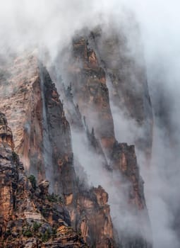 A passing rain storm produces thick clouds and fog at Zion National Park, Utah