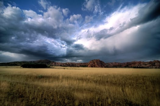 Passing storm clouds appear over Kolob Terrace at Zion National Park, Utah