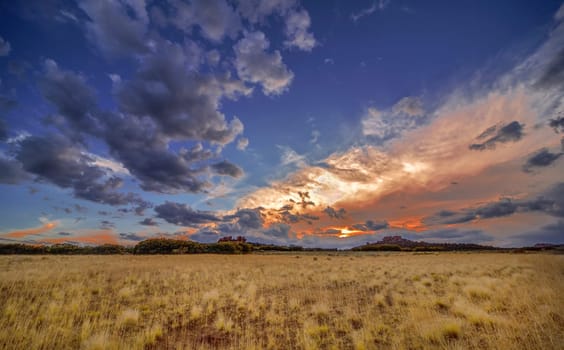 Passing storm clouds appear at sunset over Kolob Terrace at Zion National Park, Utah