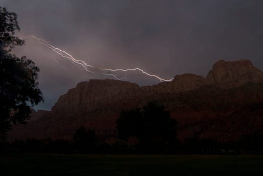 Lightning strikes above The Watchman at Zion National Park, Utah