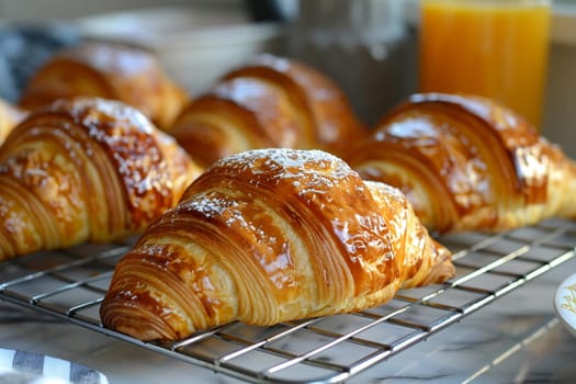 Freshly baked croissants on cooling rack, evoking aroma and breakfast delights.