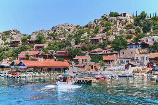 Experience the charm of traditional Turkish architecture as you cruise along serene waters, admiring quaint houses against a picturesque landscape, capturing the essence of this historic