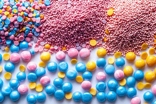 Macro shot of colorful sprinkles on a white background, creating a playful and vibrant texture.