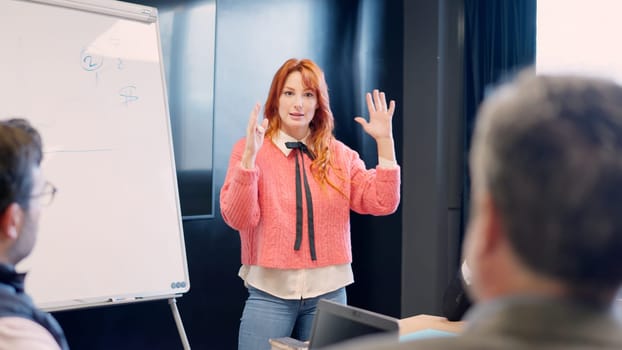 Woman clarifying an idea during a presentation in a meeting room in a coworking