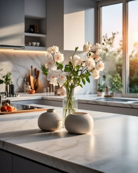 Flowers on marble table of modern kitchen interior. Cozy fashionable kitchen decor. White aesthetic kitchen interior details and decor. Empty table with copy space. Mock up