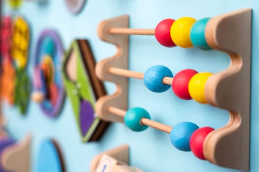 Colored balls on accounts on a children's panel for the development of a child.