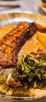 New york strip loin beef steak meat with mushroom sauce and potato wedges and salad plated on beautiful plate on a steak house