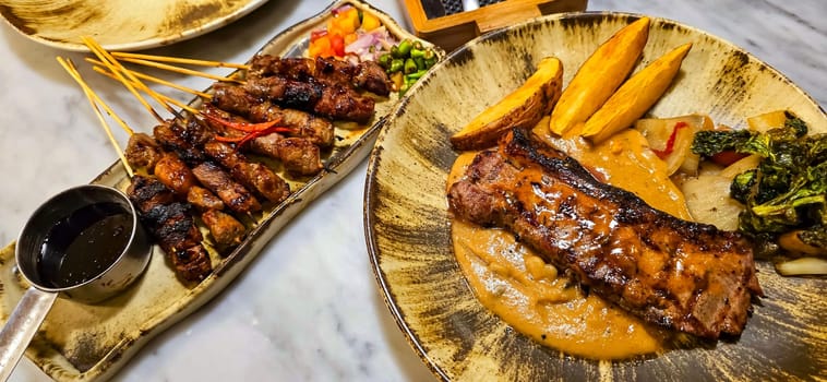 New york strip loin beef steak meat with mushroom sauce and potato wedges and salad plated on beautiful plate on a steak house