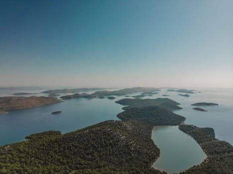 Drone aerial view of sunny landscape with sea inlets and islands of Telascica bay in National Park, Croatia