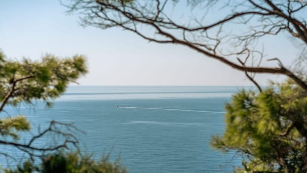 Motor boat sailing on blue sea waves in picturesque Telascica bay in Croatia. Selective focus