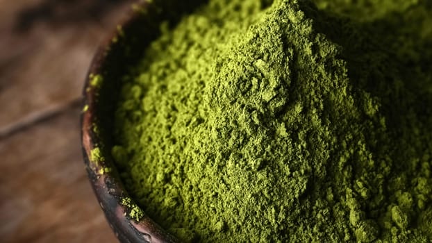 Matcha green tea powder in a bowl at the kitchen