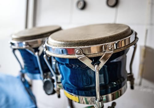 Blue drums in recording studio for hard beat perfomance closeup. Professional musical instrument for rock concerts