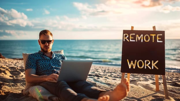 A man is sitting on a beach with remote working laptop in front of him.