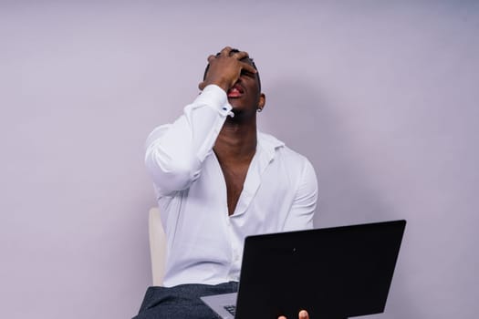 African American millennial businessman isolated on a studio background, successful male formal suit