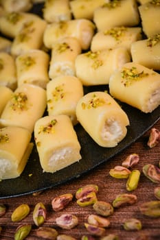 LEBANESE PASTRY RECIPE, ORIENTAL FOOD, HALAWET AL JEBEN, MOZARELLA, ASHTA AND FINE SEMOLINA. High quality photo