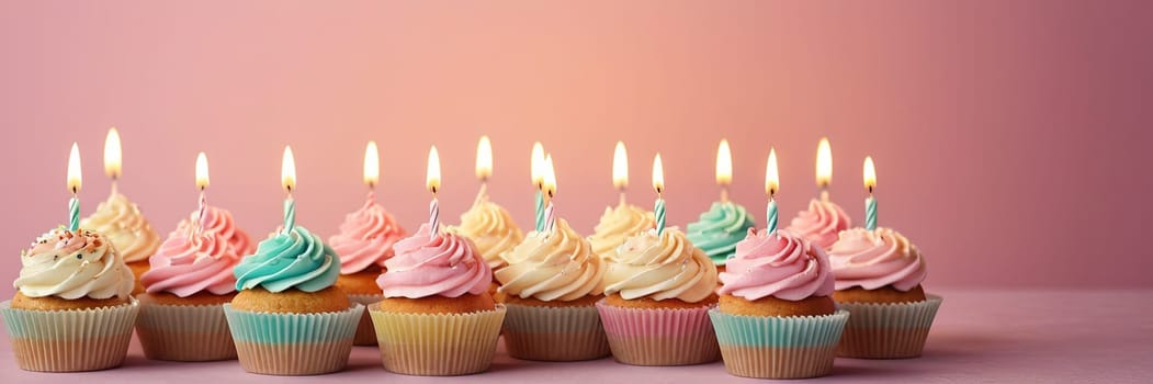 Colorful cupcakes with lit candles are displayed against a pink background, indicating an indoor celebration event marking of joy and celebrating. with free space.