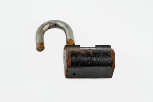 Close-up of a padlock with fragments of rust in an open state on a white background