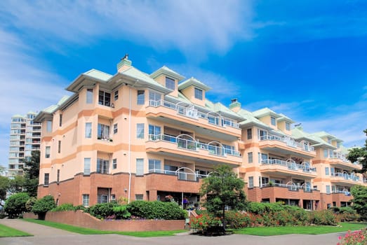 Low-rise residential building on bright sunny day in New Westminster, British Columbia, Canada.