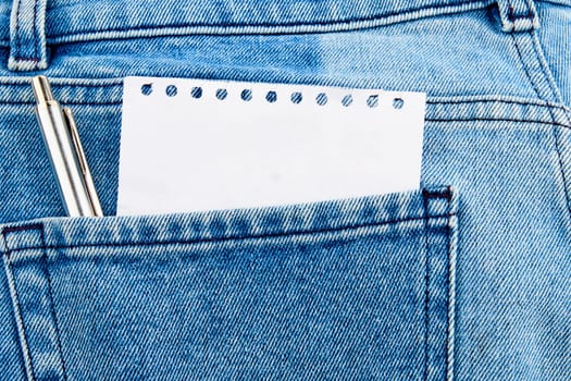 A piece of paper is visible from the pocket of jeans