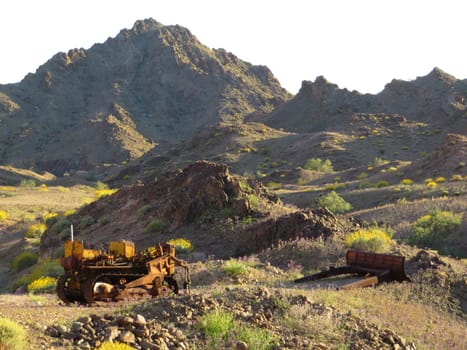 Abandoned Bulldozer at Mine Site, Springtime in Arizona Desert . High quality photo