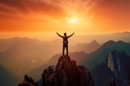 An inspirational scene of a person standing triumphantly on a mountain peak with arms raised against the backdrop of a breathtaking sunrise and rolling hills