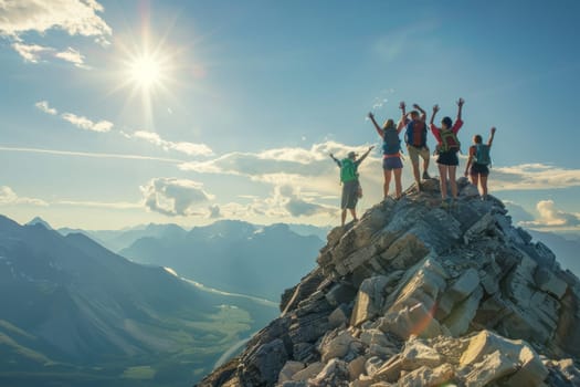A jubilant group of hikers celebrates reaching the summit, arms raised in exhilaration against the backdrop of a stunning mountain range