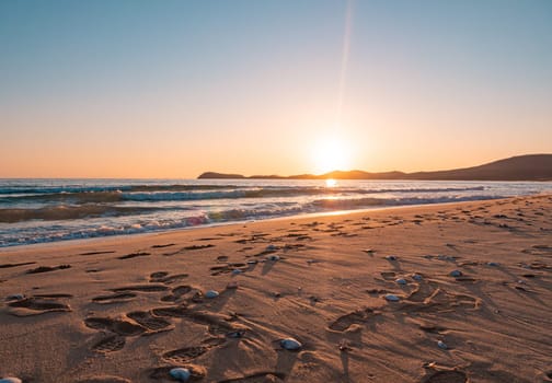 Sunset on the beach. Orange and golden sunset sky calmness tranquil relaxing sunlight summer mood.