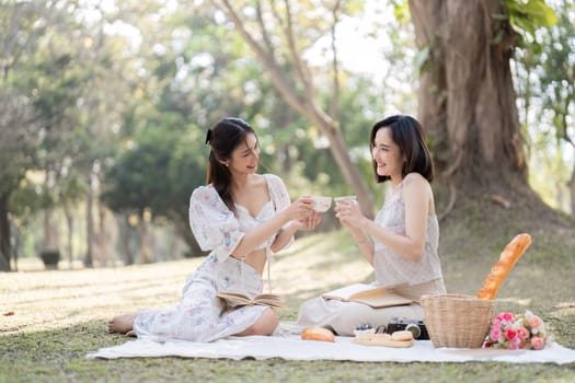 Two best friend do holiday activities, eat snacks, read books, and have picnics in the park to relax together..